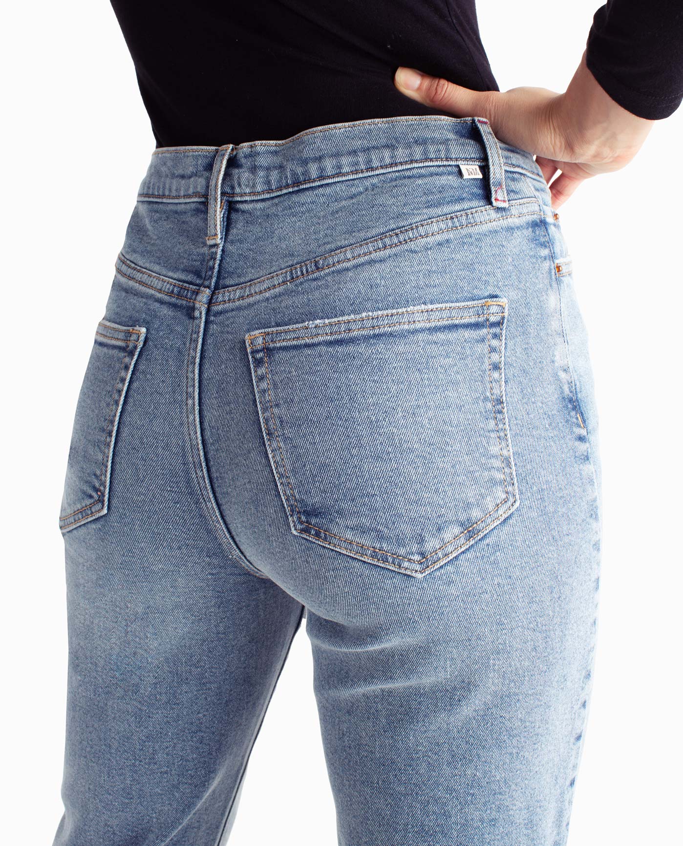 Front Detail View Of Nicole Miller Alphabet City High Rise Slim Straight Jean | NM MEDIUM BLUE