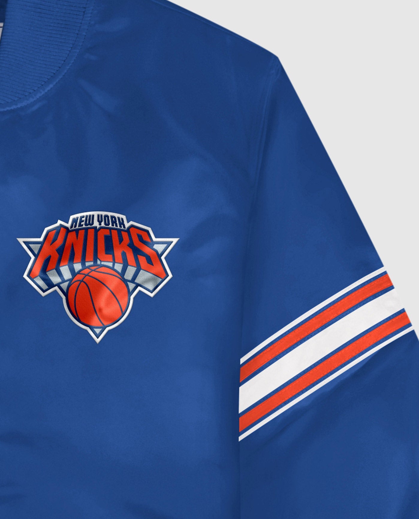 Detail View of Starter Blue New York Knicks Satin Full-Snap Starter Jacket | STR NEW YORK KNICKS BLUE