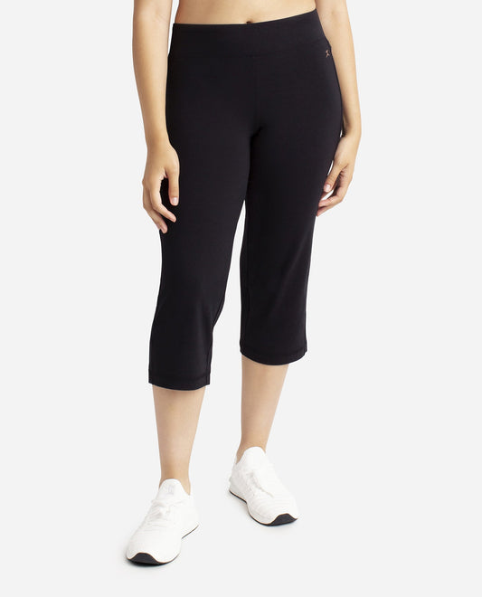 Front View of Danskin Plus Size Black Essentials Yoga Crop Pant | DSK Black