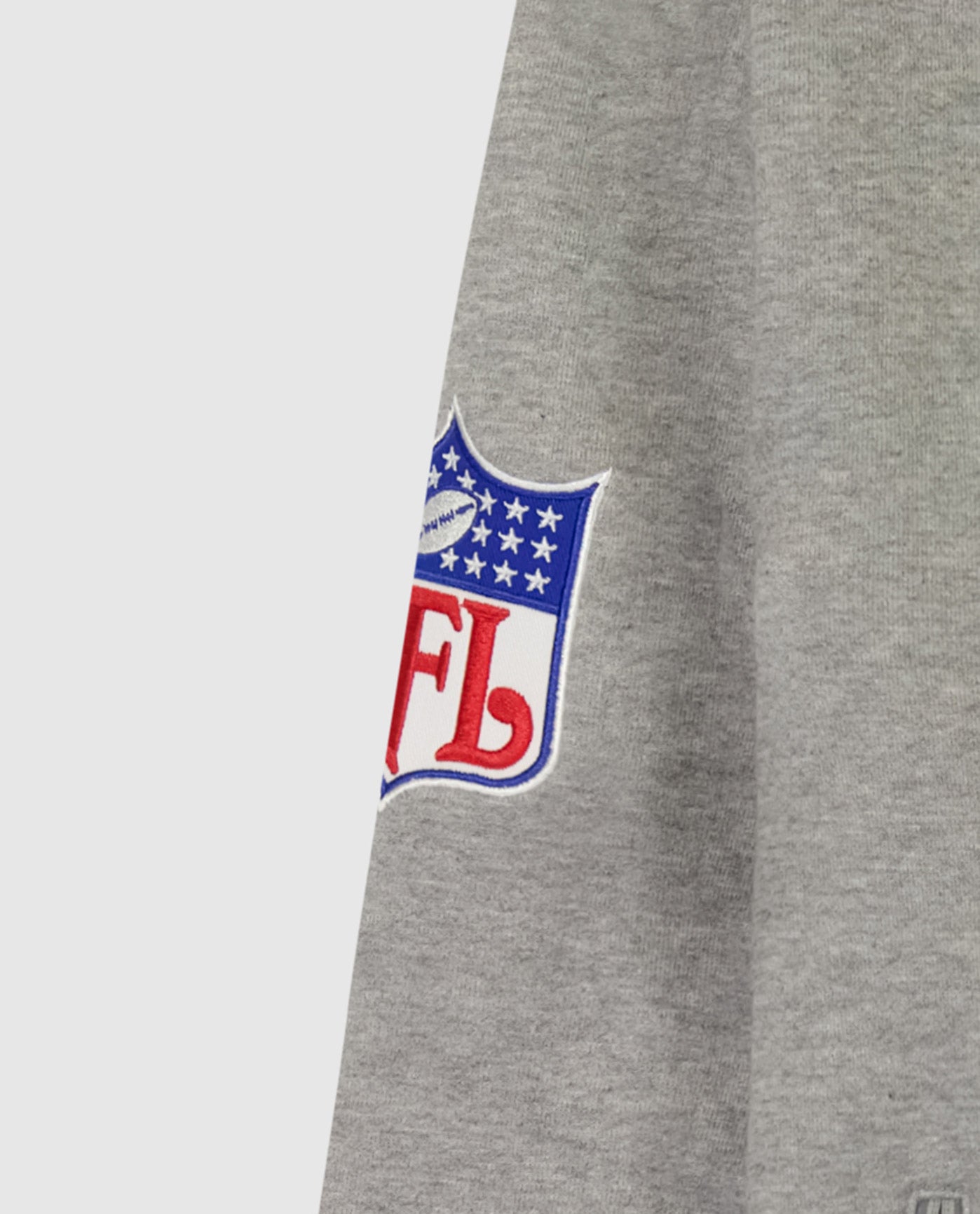 Detail View of Starter Heather Grey New York Giants Crew Neck Sweatshirt With Zip Pockets | STR NEW YORK GIANTS HEATHER GREY