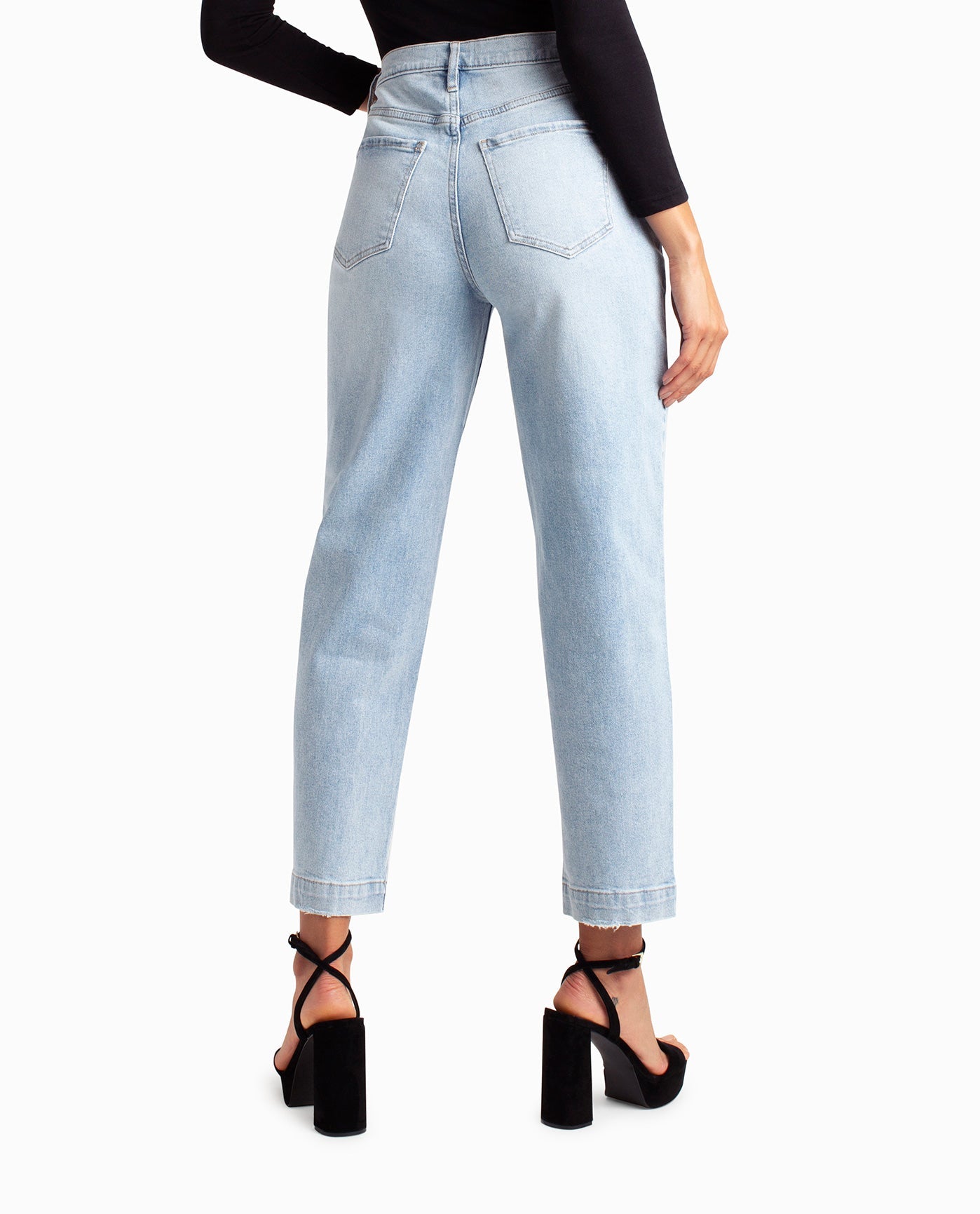 Back View Of Nicole Miller Sutton Place High Rise Pleated Taper Jean | NM LIGHT BLUE